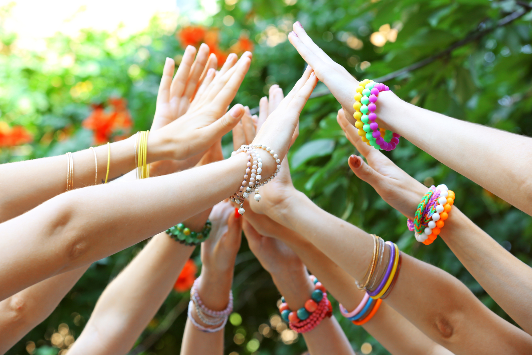 Group of People High Fiving Outdoors