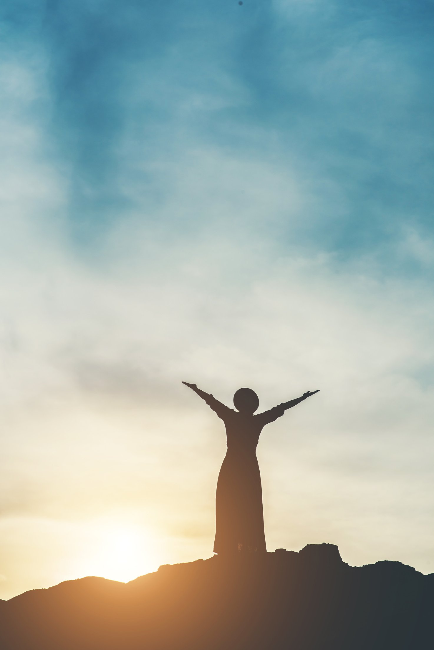 Silhouette of Woman on Top of Mountain